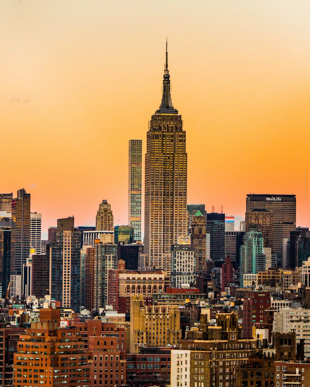 The Empire State Building above Midtown Manhattan at sunset